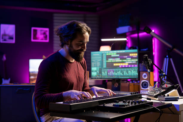 istock Musician playing electronic keyboard notes and recording tunes 2129294660
