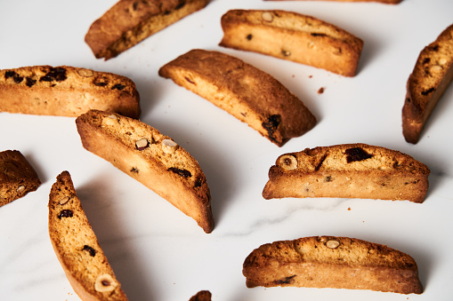 Close-Up of Assorted Almond, Hazelnut, and Cranberry Biscotti Arrayed on Pristine White Background. High quality photo