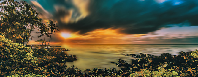 Sunset landscape with dramatic sky by motion and long exposure in Oahu, Hawaii