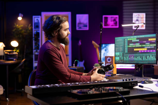 istock Sound engineer preparing to record audio files on aw software 2129299389