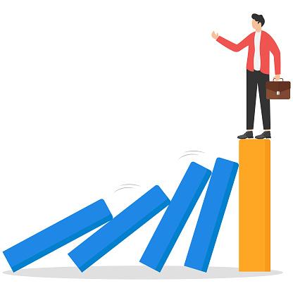 strong business during recession, well prepared management against negative economic impact, surviving company concept, Businessman standing on strong bar graph unaffected by domino effect.