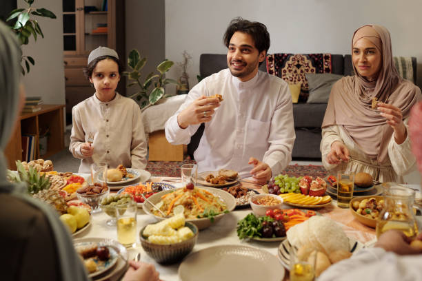 istock Muslim Family Enjoying Dinner In Majilis 2129308358