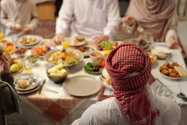 istock Unrecognizable Muslim People Having Festive Dinner 2129318892