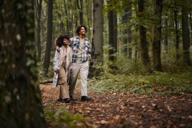 istock Happy black couple walking in autumn day at forest. 2129327768