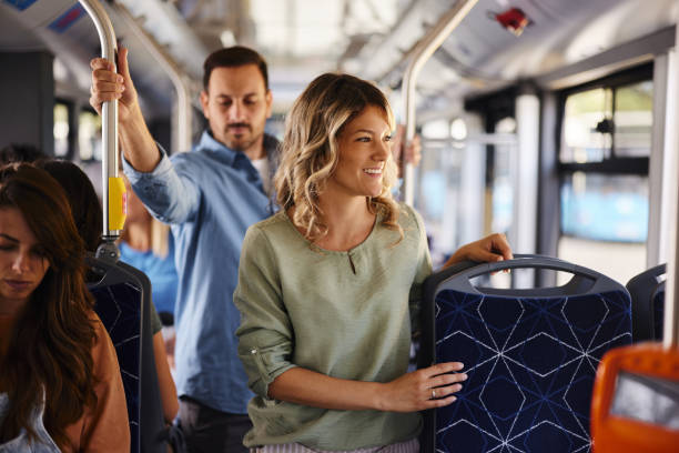 istock Group of commuters traveling by a bus. 2129352019