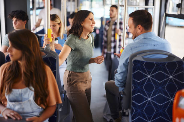 istock Happy couple talking while traveling by bus. 2129363459