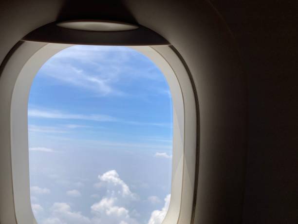 istock view from an airplane’s shade, seeing the cloudscape 2129376418