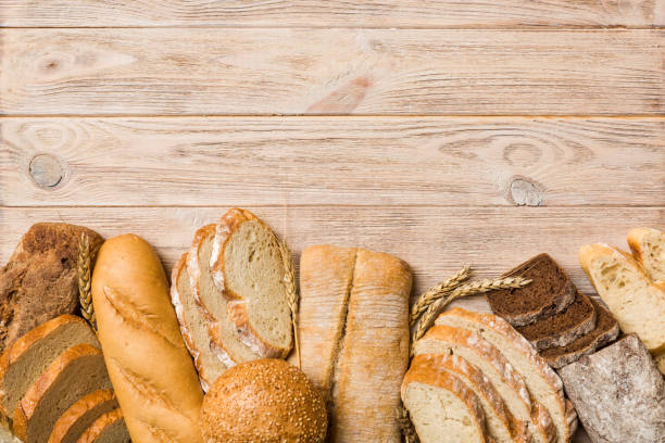 istock Homemade natural breads. Different kinds of fresh bread as background, top view with copy space 2129381696