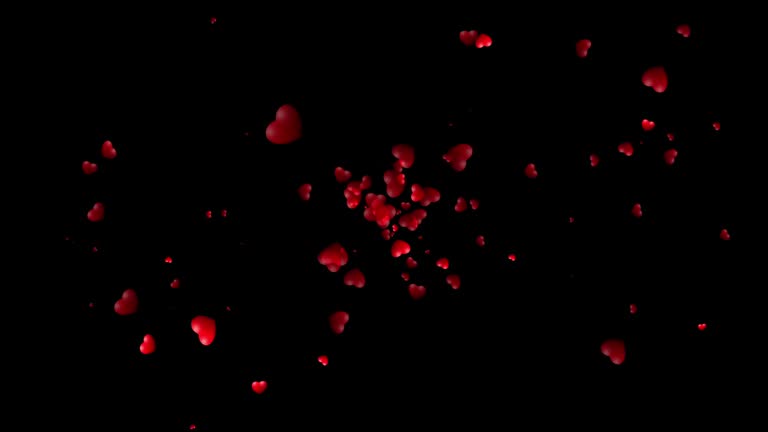 Flying red hearts on a black background. A staggering burst of likes. Valentine's Day.