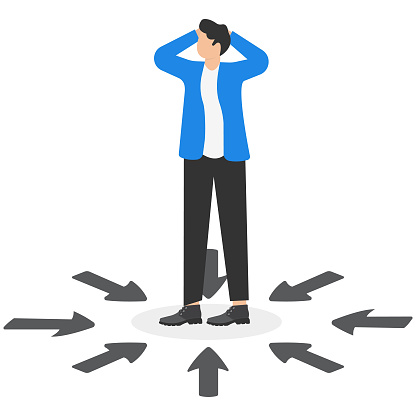 Choosing the right business direction, finding solution to solve problem, confusion, hesitation and uncertainty concept, Businessman standing among many arrows with different directions.
