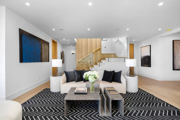 istock Spacious living room with a large white sofa and two coffee tables. 2129432029