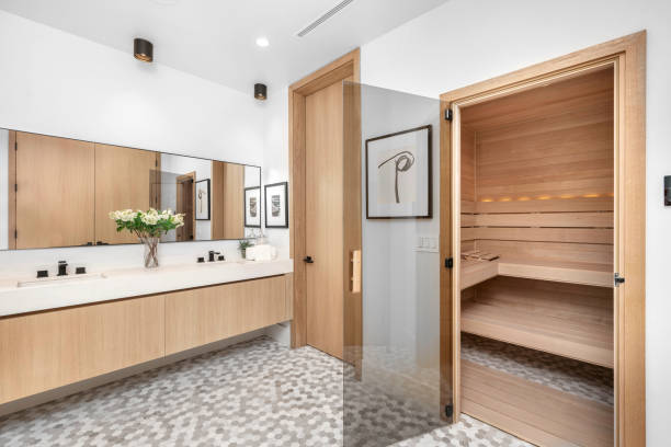 istock Modern bathroom with spacious wooden cabinets, white countertops, and a double sink. 2129433084