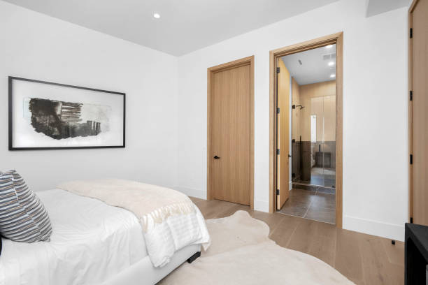 istock Bedroom interior with bed, dresser, and wardrobe. 2129435666