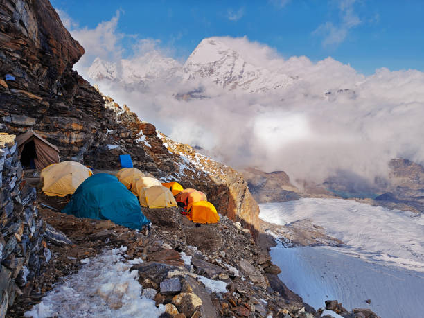 istock Himalayan mountain camp in Nepal, colorful tents, glacier, and clouds 2129441368