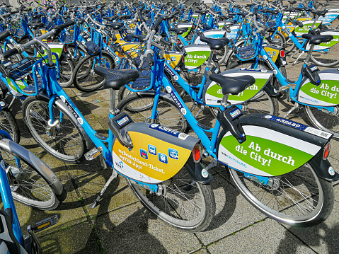 Heidelberg, Germany: March 30, 2024: Large number of Rental bikes of the Company nextbike waiting for summer use near main Railway Station in Heidelberg, Germany