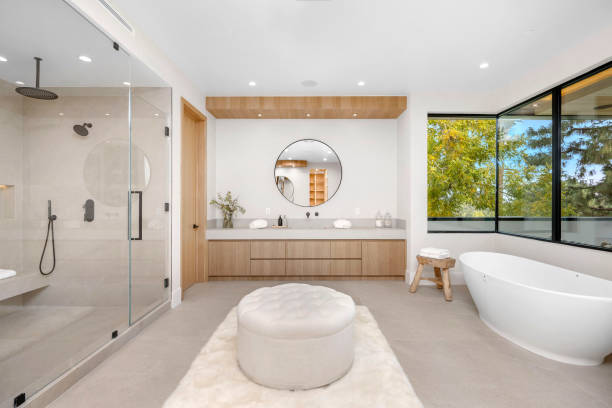 White bathroom with bathtub and shower.