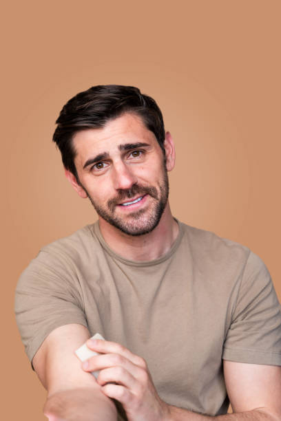 istock Confident man with a subtle smile in casual attire 2129494654