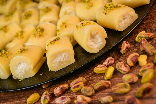 LEBANESE PASTRY RECIPE, ORIENTAL FOOD, HALAWET AL JEBEN, MOZARELLA, ASHTA AND FINE SEMOLINA. High quality photo