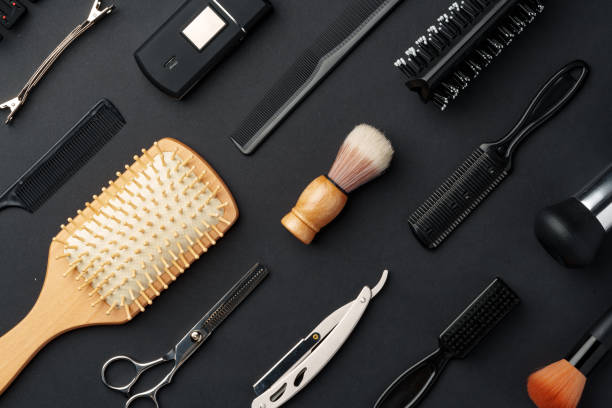 istock Variety of Hair Styling Tools and Accessories Displayed on a Dark Background 2129502664