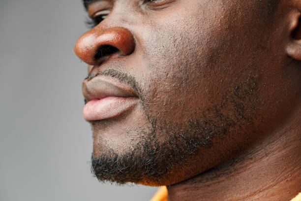 istock Close-Up of African Mans Lower Face and Lips 2129502673