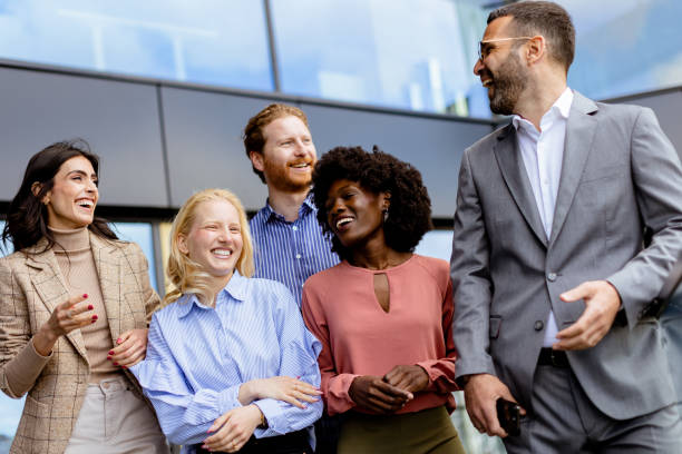 istock Casual Networking Event at Office, Professionals Mingling in Modern Glass Building. 2129503009