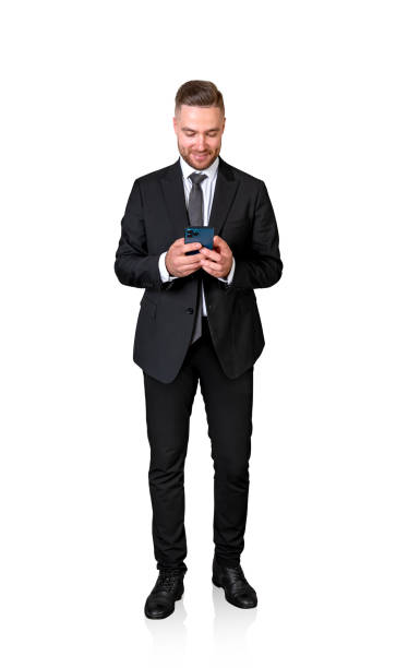 istock Smiling businessman typing in the phone, isolated over white background 2129503825