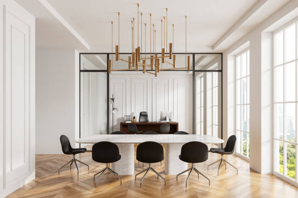 istock Stylish office interior with stone table and chairs, workplace and window 2129515515