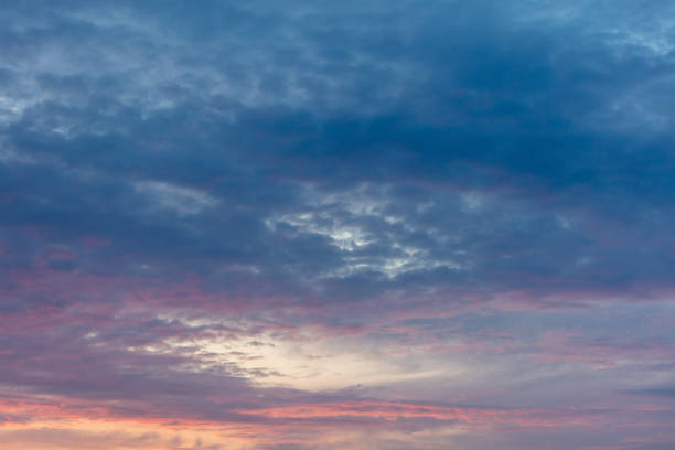 istock Pink blue clouds at sunset as background 2129516064