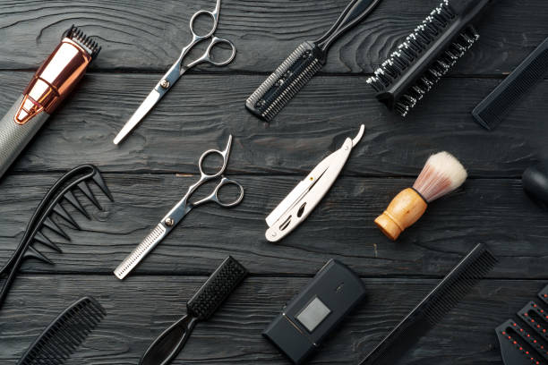 istock Professional Barber Tools Laid Out on Dark Wooden Surface 2129516584