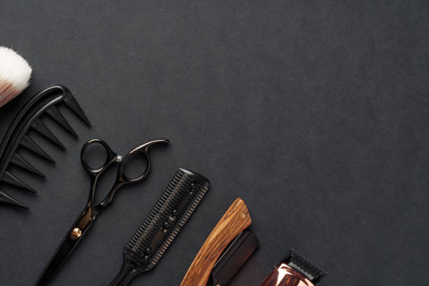 istock An Assortment of Professional Hairdressing Tools Laid Out on a Dark Surface 2129516585