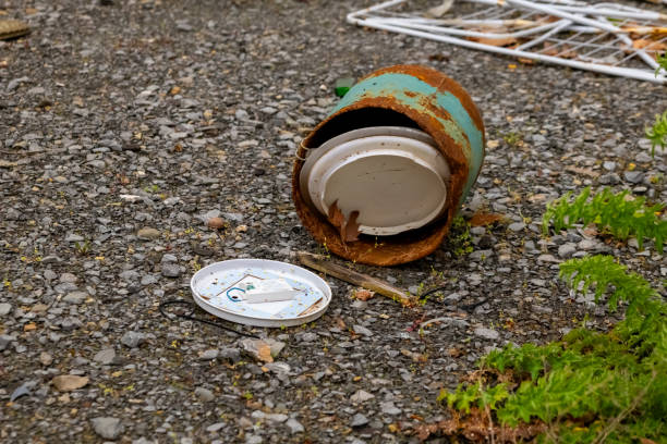 istock trash can is open and has a white lid on the ground 2129517707