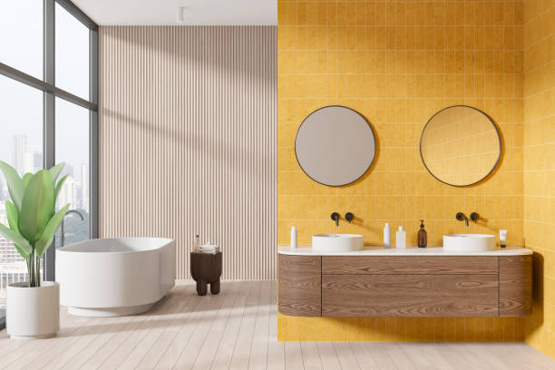 Modern hotel bathroom interior with tub and double sink, panoramic window