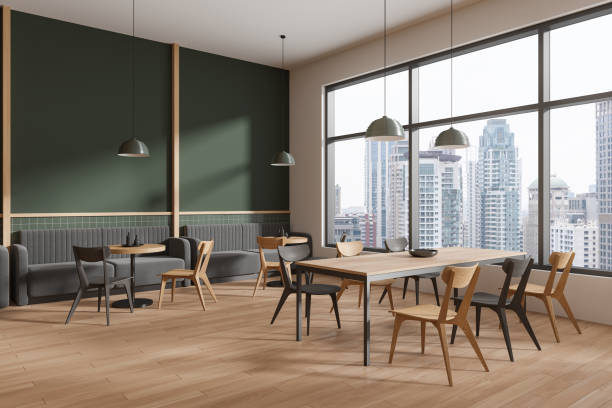 istock Cozy restaurant interior with chairs and shared table near panoramic window 2129520460