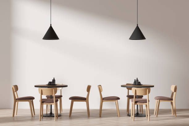 istock Minimalist beige cafe interior with chairs and table with dishes 2129525262