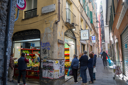 Genoa in Liguria Italy on October 30, 2023 narrow streets with shops in the old town.