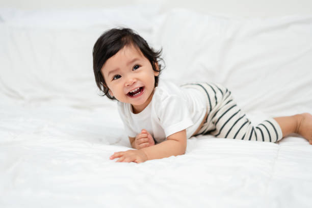 istock happy toddler baby on bed 2129561332