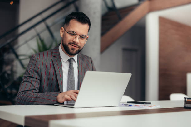 istock Businessman working on laptop in the office 2129563912