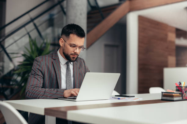 Businessman working on laptop in the office