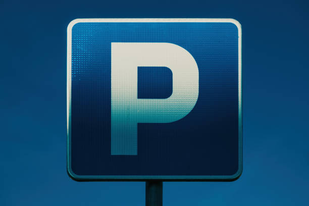 Blue parking sign for visitors.