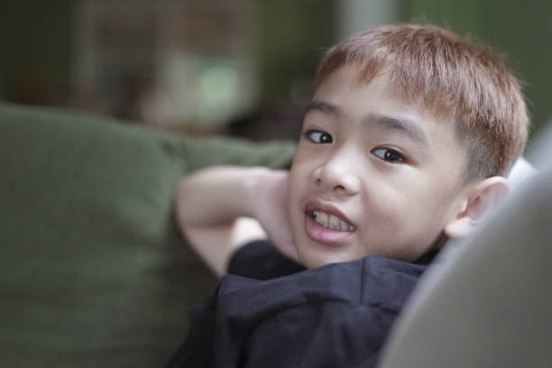 istock Portrait Face Child boy on Sofa 2129570304