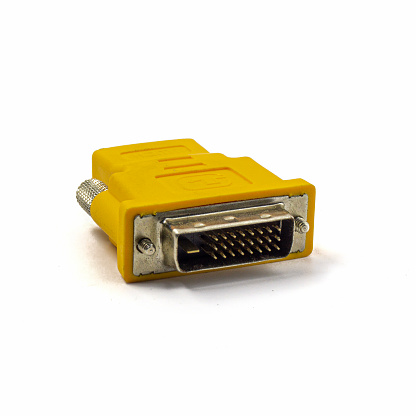 HDMI female to DVI male adapter gold contacts, yellow case on the isolated background.