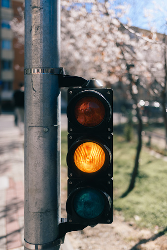 Close-up view of a traffic light with a blurred background