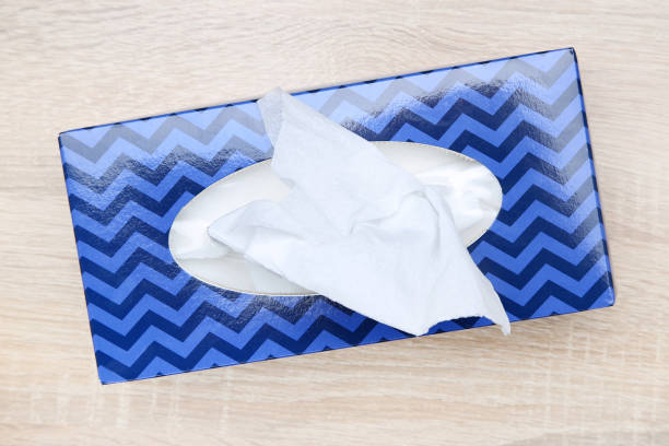 Paper napkin box on brown wooden table