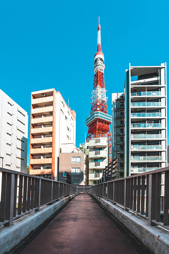 Tokyo tower locate on the street in tokyo town when clear sky, Japan
