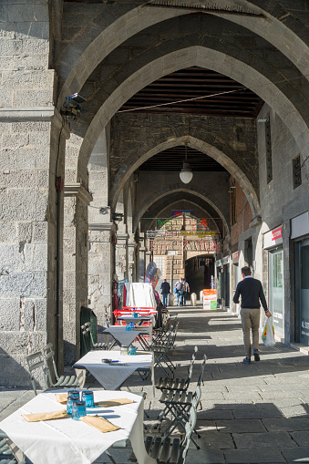 Genoa in Liguria Italy on October 30, 2023 Arcades opposite the old port of Genoa with fishmongers bar and terraces.