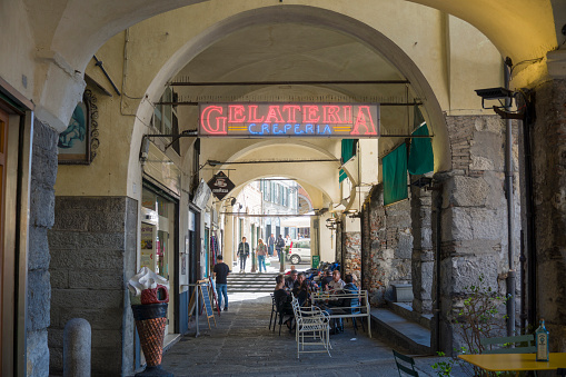 Genoa in Liguria Italy on October 30, 2023 shops and terraces under the arcades near the old port.