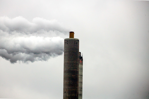 Steam and polluting smoke rises from the chimney of waste incinerator AEB in Amsterdam in the Netherlands