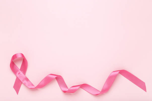 istock Breast cancer concept. Pink ribbon 2129692638