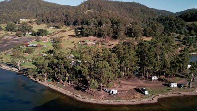 Campervans At Gordon Foreshore Reserve Campground In Tasmania, Australia. drone shot