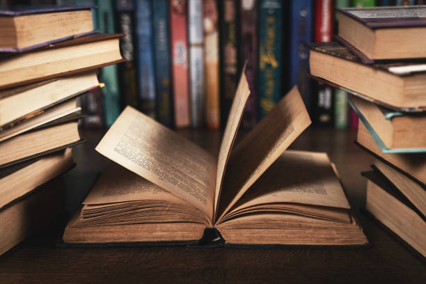 istock Education learning concept with opening book or textbook in old library 2129723684